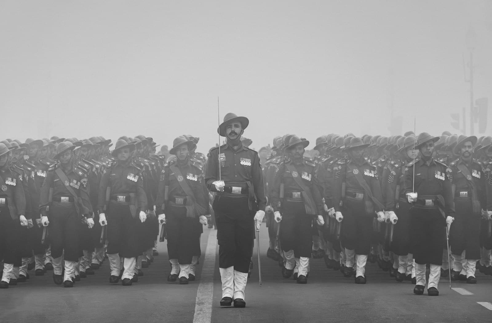 An army contingent marching in parade formation