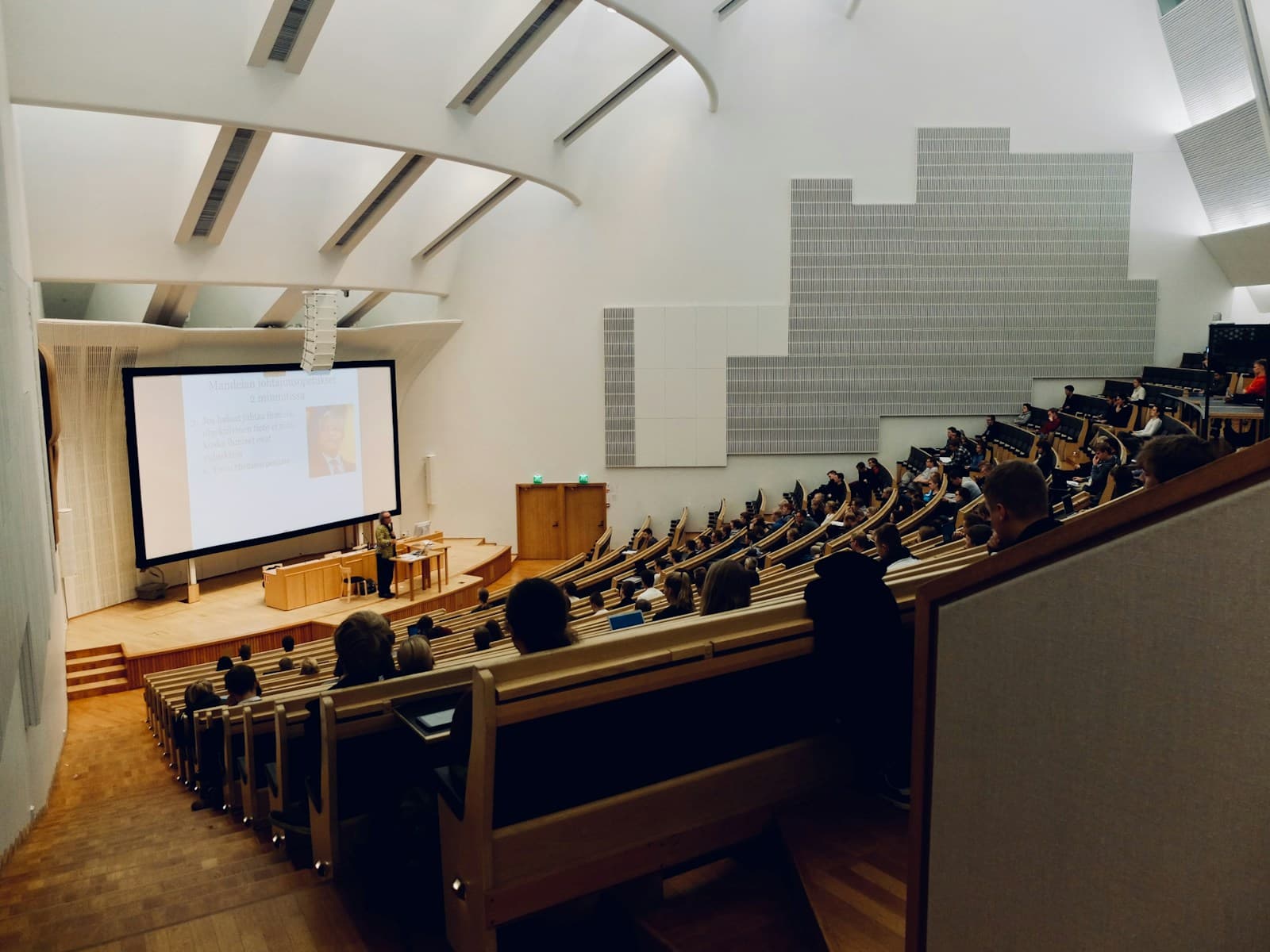 Students seated in a university lecture theatre