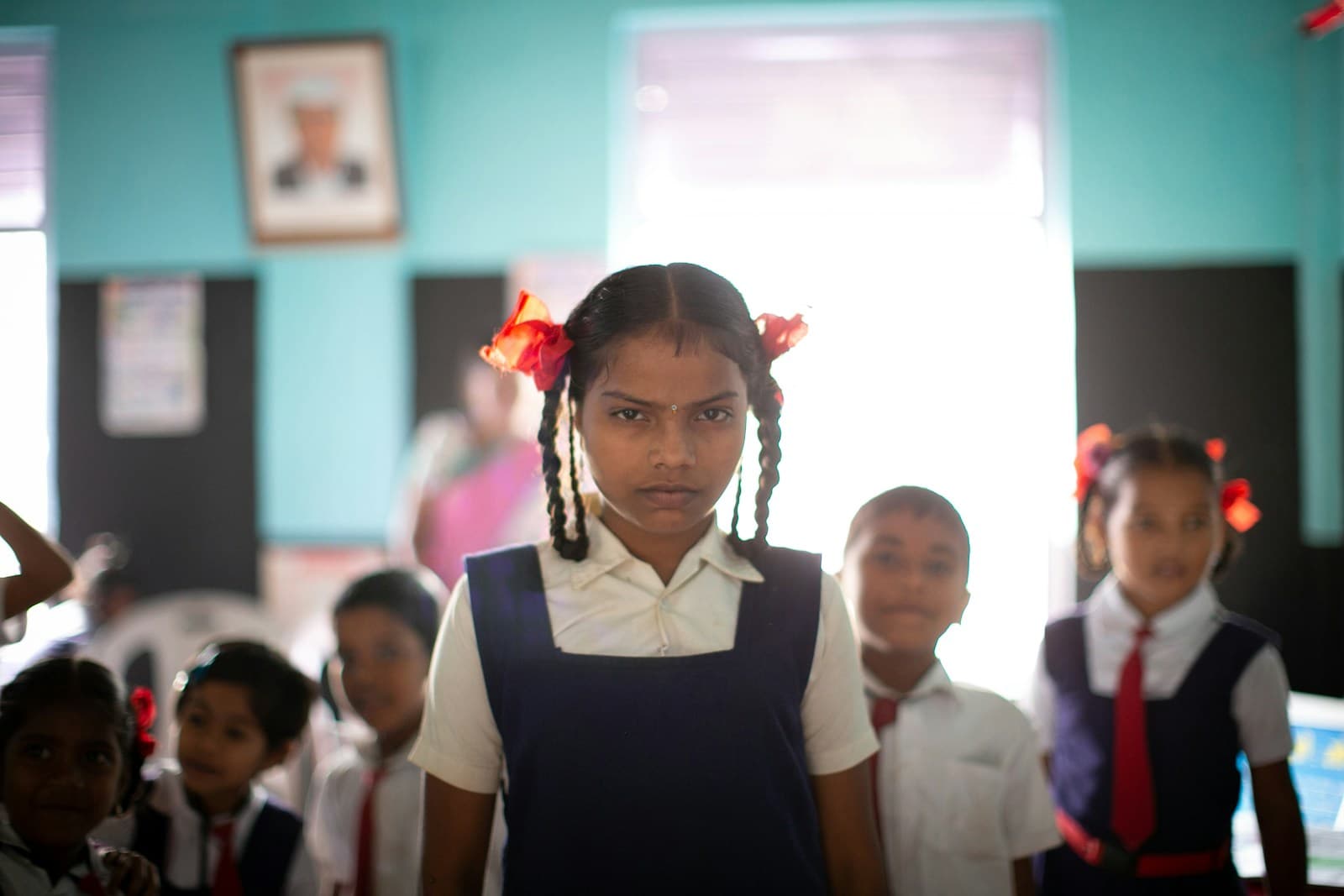 Schoolchildren in uniform in a classroom